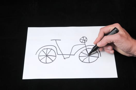 A Caucasian Male Hand Drawing on a White Paper