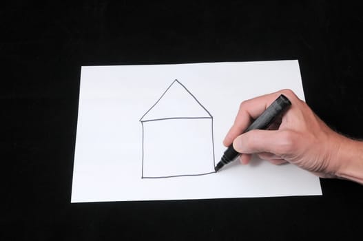 A Caucasian Male Hand Drawing on a White Paper