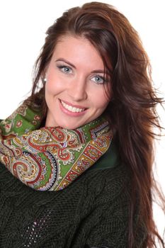 portrait of a beautiful happy woman in a knitted jacket