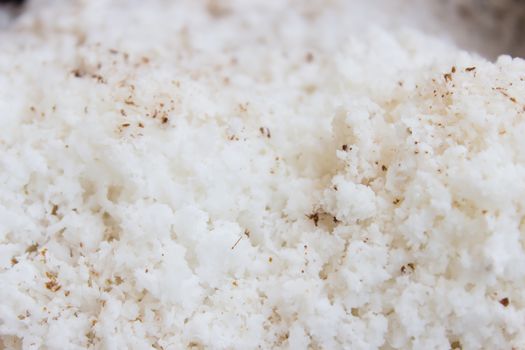 Sweetened flaked coconut ready to be used as a cooking or baking ingredient or as a garnish.