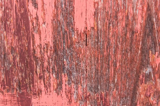 close-up red wood  peeling paint