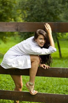 Sexy young Brunette in a summer park