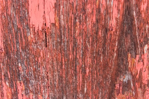 close-up red wood  peeling paint