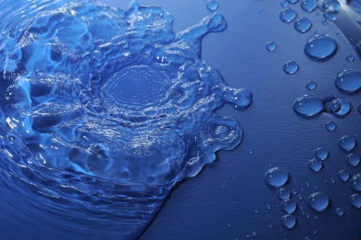 Some Water Drops on a Blue Textured Background