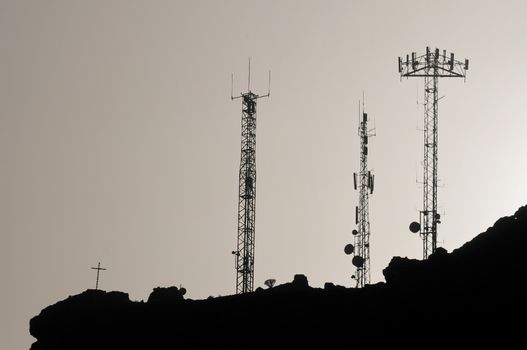 Some Silhouetted Antennas on the top of a Hill