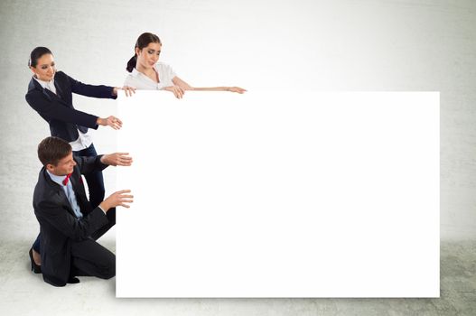 small group of people holding a blank banner, place for text