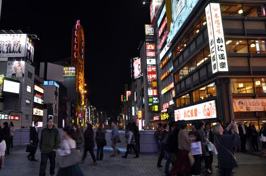 OSAKA, JAPAN - OCT 23: People visit famous Dotonbori street on October 23, 2012 in Osaka, Japan. According to Tripadvisor Dotonbori is the 3rd best attraction to visit in Osaka. 