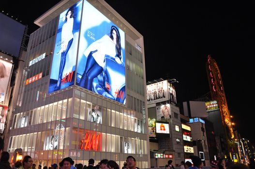 OSAKA, JAPAN - OCT 23: People visit famous Dotonbori street on October 23, 2012 in Osaka, Japan. According to Tripadvisor Dotonbori is the 3rd best attraction to visit in Osaka. 