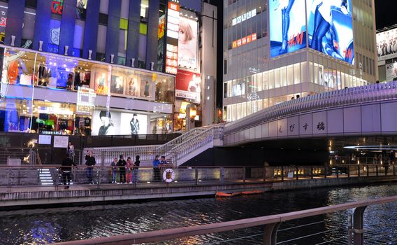 OSAKA, JAPAN - OCT 23: People visit famous Dotonbori street on October 23, 2012 in Osaka, Japan. According to Tripadvisor Dotonbori is the 3rd best attraction to visit in Osaka. 