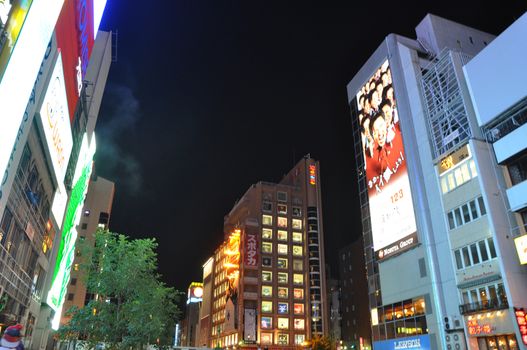 OSAKA, JAPAN - OCT 23: People visit famous Dotonbori street on October 23, 2012 in Osaka, Japan. According to Tripadvisor Dotonbori is the 3rd best attraction to visit in Osaka. 