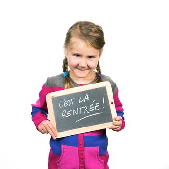 happy school girl with a traditionnal slate in his hands