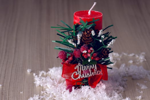 Decorative christmas composition from red candle