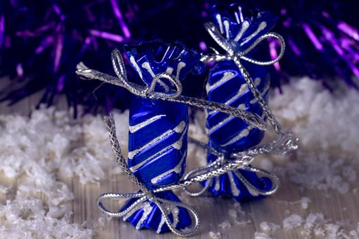 Gift box stands near the snow-covered trees