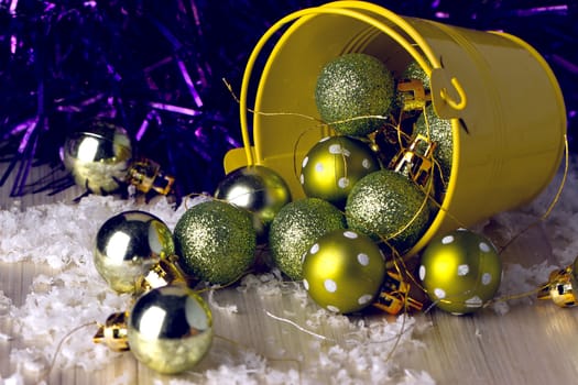 Christmas ornaments in a decorative bucket