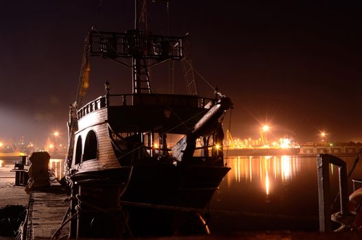 Old wooden ship at night ,Odessa port,Ukraine