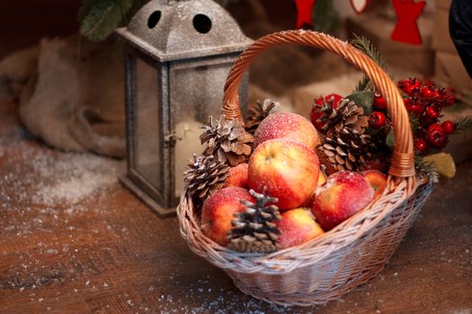 Fresh red apple with christmas toys in the basket