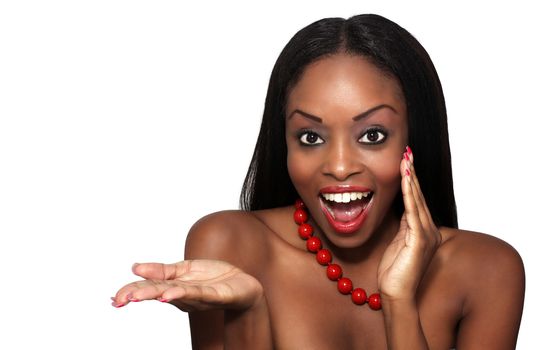 Studio close-up of an extraordinarily beautiful young woman with an excited facial expression and her hand extended, palm up.