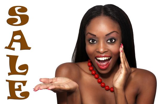 Studio close-up of an extraordinarily beautiful young woman with an excited facial expression and her hand extended, palm up, toward the word "SALE" on frame left.