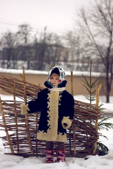 Baby girl's portrait in old russian style with pavlovsky posad shawls