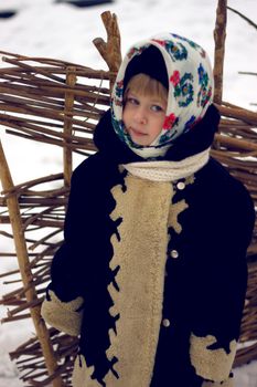 Baby girl's portrait in old russian style with pavlovsky posad shawls