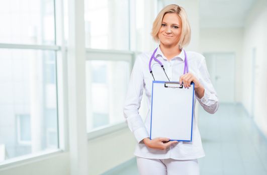 female doctor holding empty clipboard