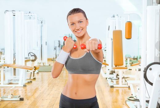 sportswoman with red weights