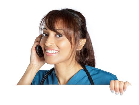 Attractive Indian doctor woman posing in a studio in front of a background