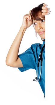 Attractive Indian doctor woman posing in a studio in front of a background