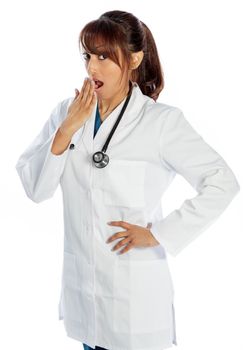 Attractive Indian doctor woman posing in a studio in front of a background