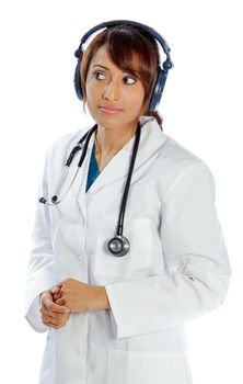 Attractive Indian doctor woman posing in a studio in front of a background