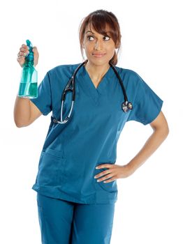 Attractive Indian doctor woman posing in a studio in front of a background