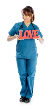 Attractive Indian doctor woman posing in a studio in front of a background