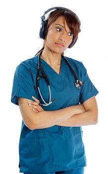 Attractive Indian doctor woman posing in a studio in front of a background