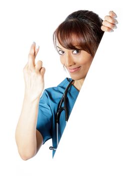 Attractive Indian doctor woman posing in a studio in front of a background