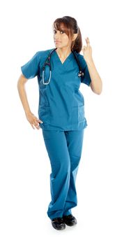 Attractive Indian doctor woman posing in a studio in front of a background