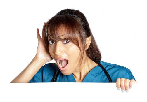 Attractive Indian doctor woman posing in a studio in front of a background