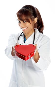 Attractive Indian doctor woman posing in a studio in front of a background