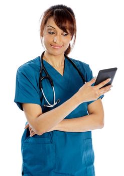 Attractive Indian doctor woman posing in a studio in front of a background