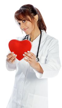 Attractive Indian doctor woman posing in a studio in front of a background