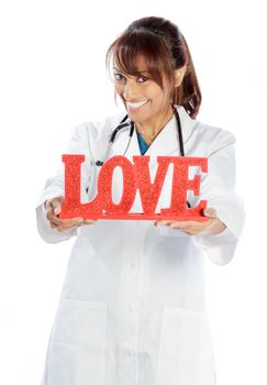 Attractive Indian doctor woman posing in a studio in front of a background