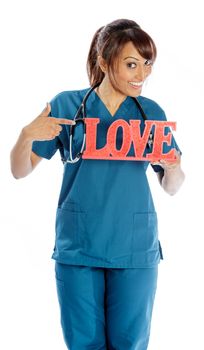 Attractive Indian doctor woman posing in a studio in front of a background