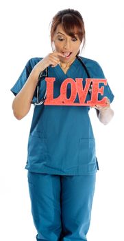 Attractive Indian doctor woman posing in a studio in front of a background