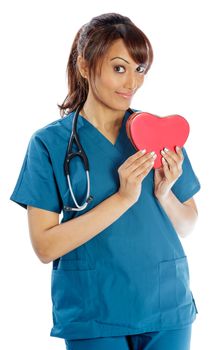 Attractive Indian doctor woman posing in a studio in front of a background