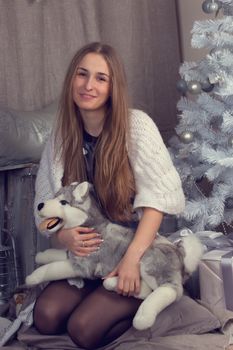 Girl surrounded by festive Christmas paraphernalia