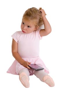 Ballerina Girl with her Tutu holding a smart phone in her giving a thoughtful pose