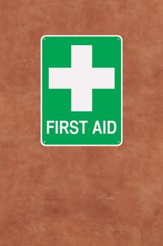 A first aid sign mounted on a wall