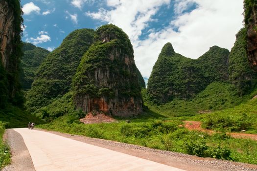 Road through karst limestone mountains in asia