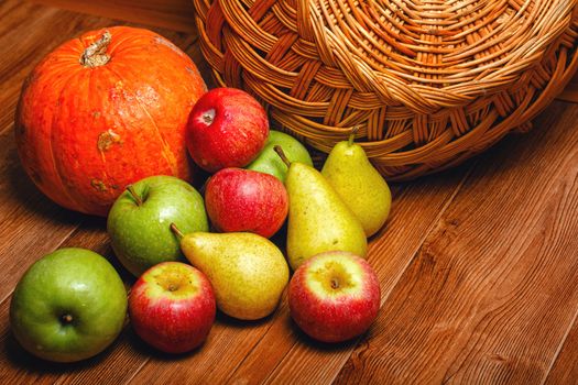 Harvest of ripe fruits and vegetables: apples, pears and pumpkin