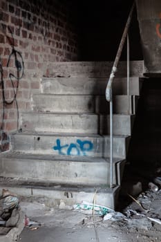 Creepy staircase in abandoned warehouse