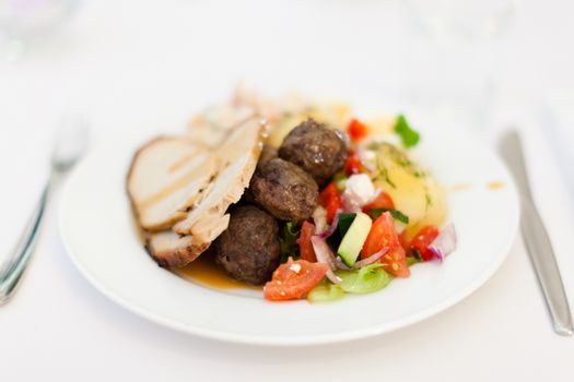 Food on a white plate in a white background